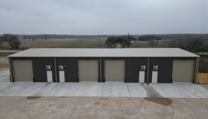 side view of commercial metal building showing divided layout and multiple entry points in Bryan Texas